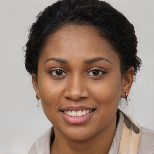 Joyful latino young-adult female with long  brown hair and brown eyes