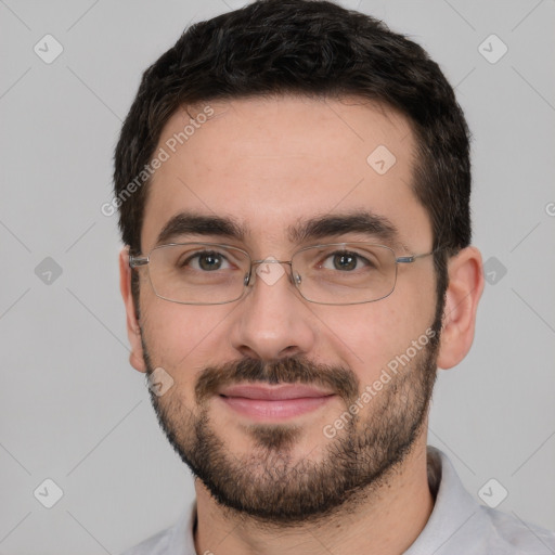 Joyful white young-adult male with short  black hair and brown eyes