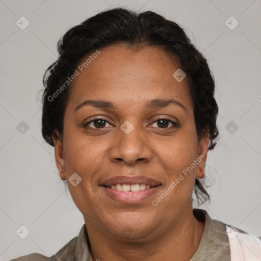 Joyful black adult female with medium  brown hair and brown eyes