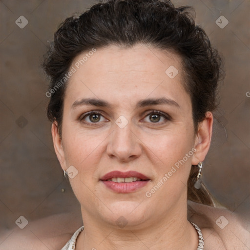 Joyful white adult female with short  brown hair and brown eyes