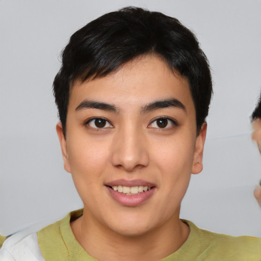 Joyful asian young-adult male with short  black hair and brown eyes