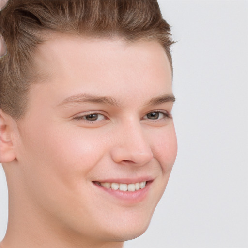 Joyful white child male with short  brown hair and brown eyes