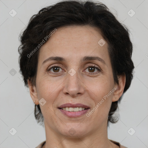 Joyful white adult female with short  brown hair and brown eyes