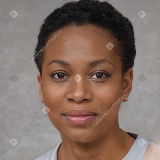 Joyful black young-adult female with short  black hair and brown eyes