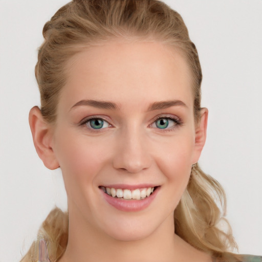 Joyful white young-adult female with long  brown hair and blue eyes