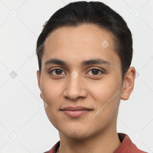 Joyful latino young-adult male with short  brown hair and brown eyes