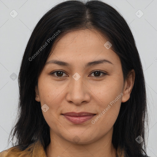 Joyful latino young-adult female with long  brown hair and brown eyes