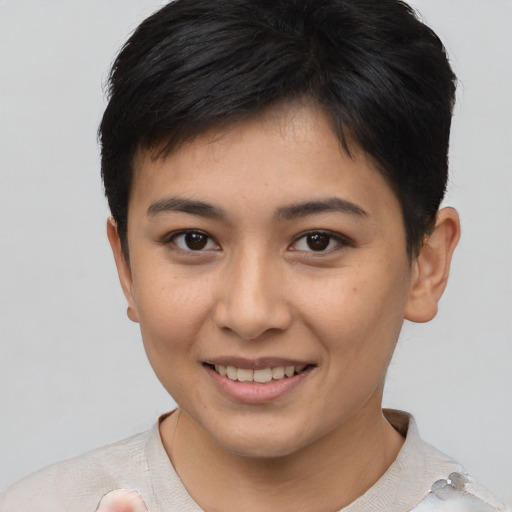 Joyful asian young-adult female with short  brown hair and brown eyes