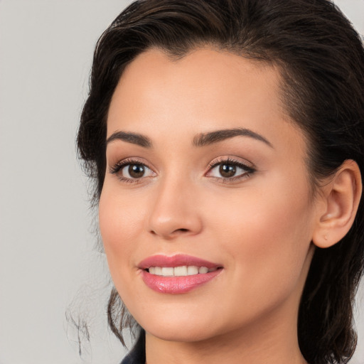 Joyful white young-adult female with long  brown hair and brown eyes