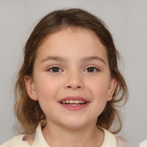 Joyful white child female with medium  brown hair and brown eyes