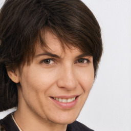 Joyful white adult female with short  brown hair and brown eyes