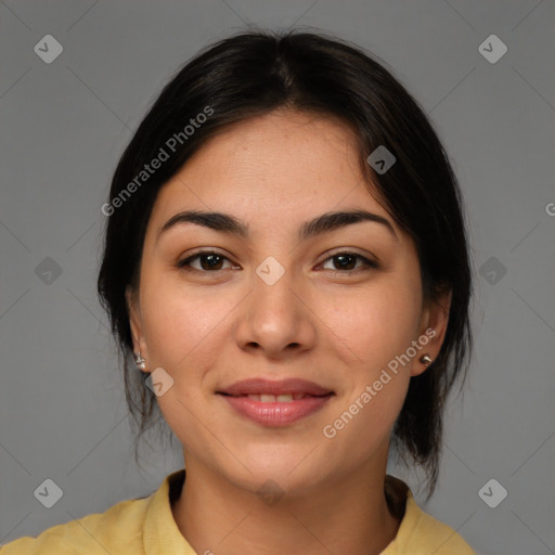 Joyful latino young-adult female with medium  brown hair and brown eyes