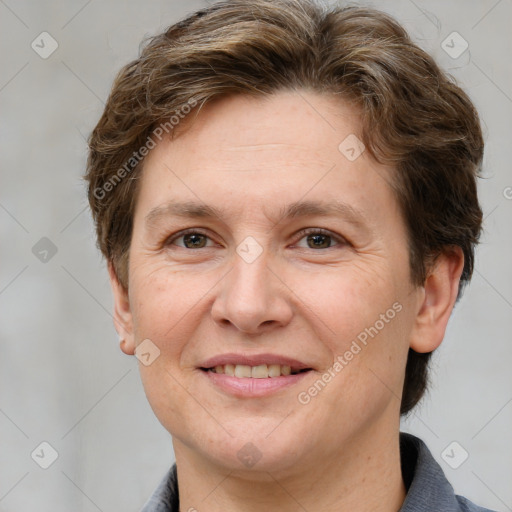 Joyful white adult female with short  brown hair and grey eyes