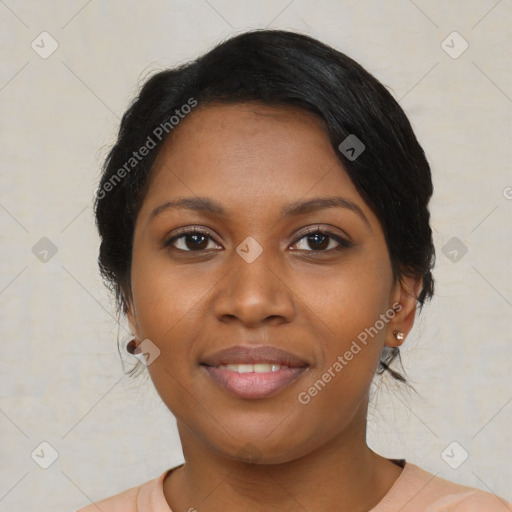 Joyful black young-adult female with medium  black hair and brown eyes