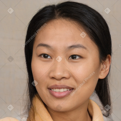 Joyful latino adult female with medium  brown hair and brown eyes