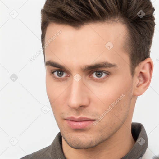 Neutral white young-adult male with short  brown hair and brown eyes