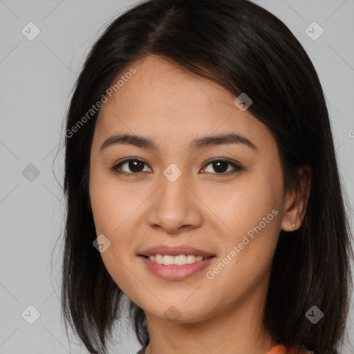 Joyful asian young-adult female with long  brown hair and brown eyes