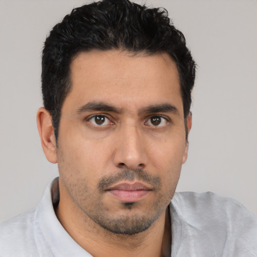 Neutral white young-adult male with short  black hair and brown eyes