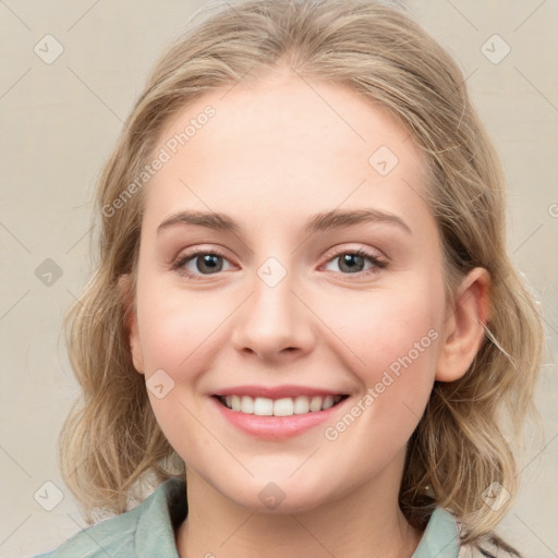 Joyful white young-adult female with medium  brown hair and blue eyes