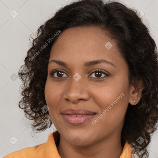 Joyful black young-adult female with medium  brown hair and brown eyes