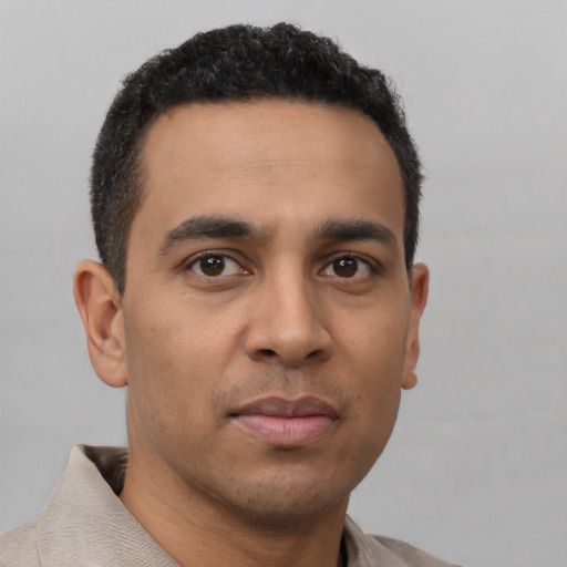 Neutral latino young-adult male with short  brown hair and brown eyes