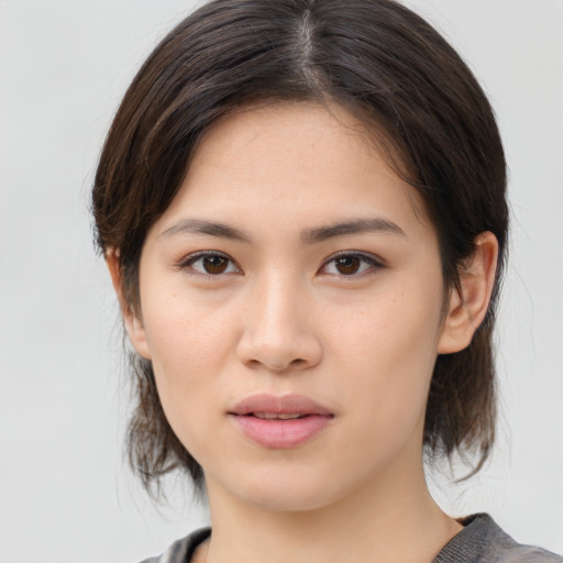 Neutral asian young-adult female with medium  brown hair and brown eyes