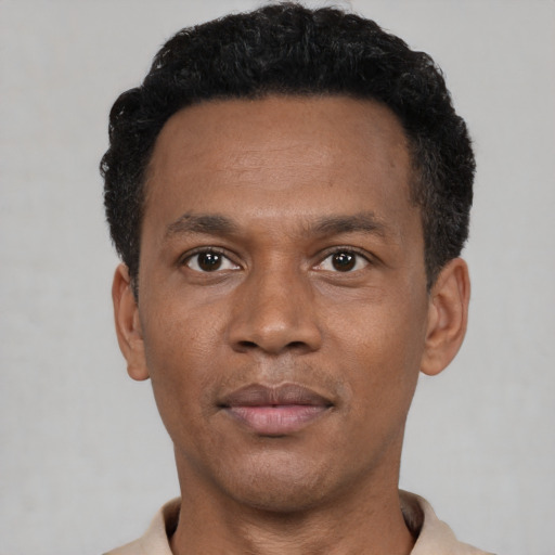 Neutral black young-adult male with short  black hair and brown eyes