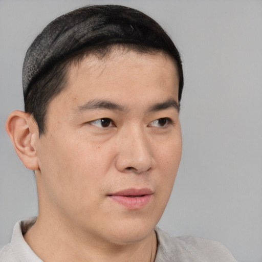 Neutral asian young-adult male with short  brown hair and brown eyes