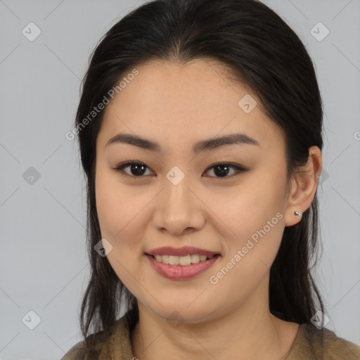 Joyful latino young-adult female with medium  brown hair and brown eyes