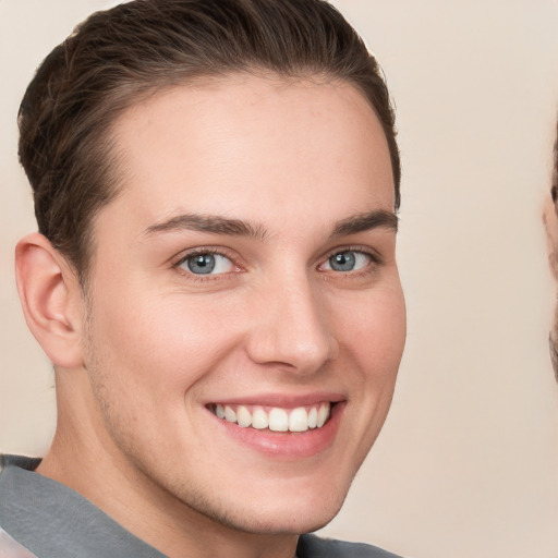 Joyful white young-adult female with short  brown hair and grey eyes