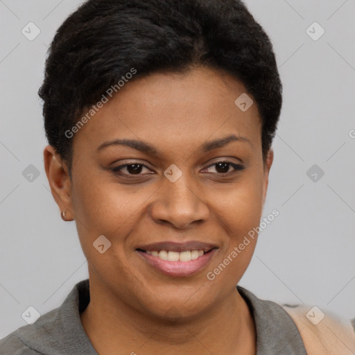 Joyful black young-adult female with short  brown hair and brown eyes