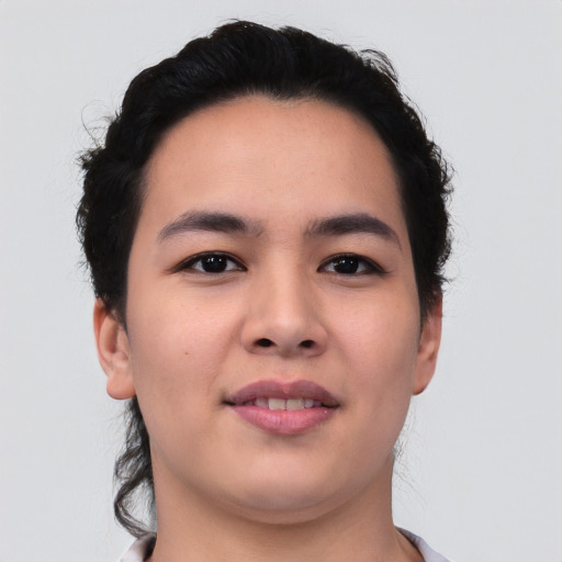 Joyful asian young-adult female with short  brown hair and brown eyes
