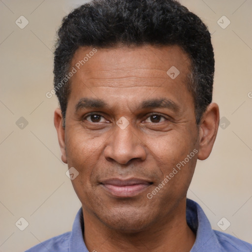 Joyful latino adult male with short  black hair and brown eyes