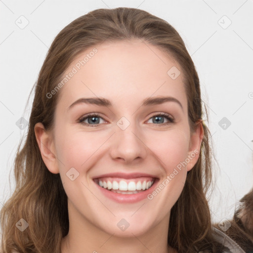 Joyful white young-adult female with long  brown hair and grey eyes