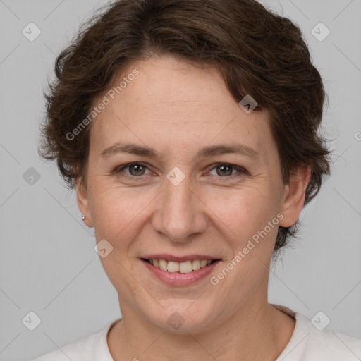 Joyful white adult female with short  brown hair and brown eyes