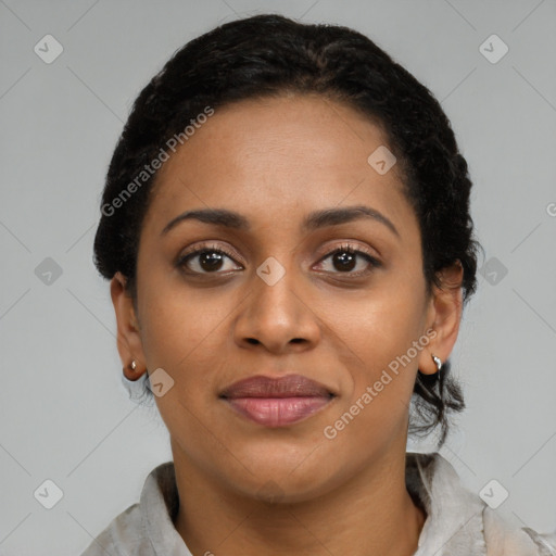Joyful black young-adult female with short  black hair and brown eyes