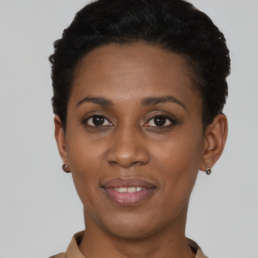 Joyful latino young-adult female with short  black hair and brown eyes