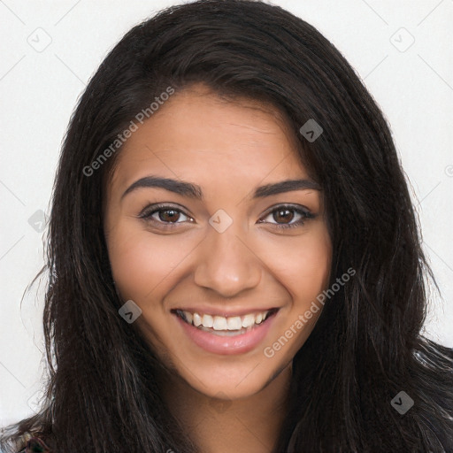 Joyful latino young-adult female with long  brown hair and brown eyes