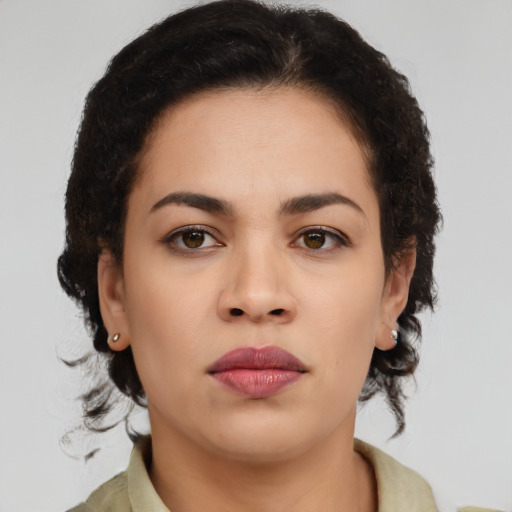 Neutral latino young-adult female with medium  brown hair and brown eyes