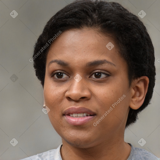 Joyful black young-adult female with short  brown hair and brown eyes