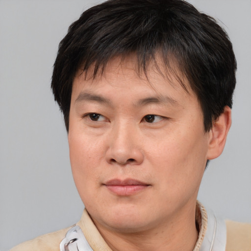 Neutral asian young-adult male with short  brown hair and brown eyes