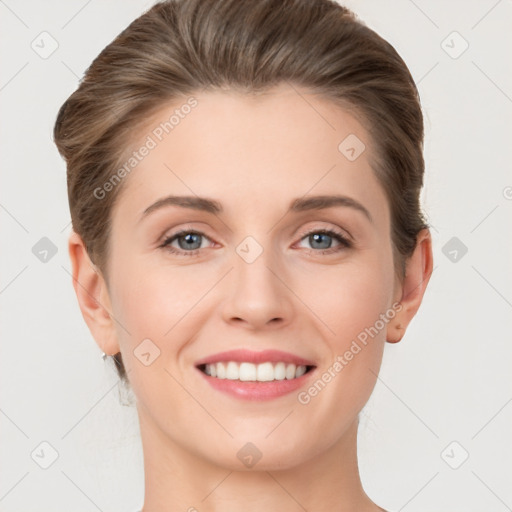 Joyful white young-adult female with short  brown hair and grey eyes