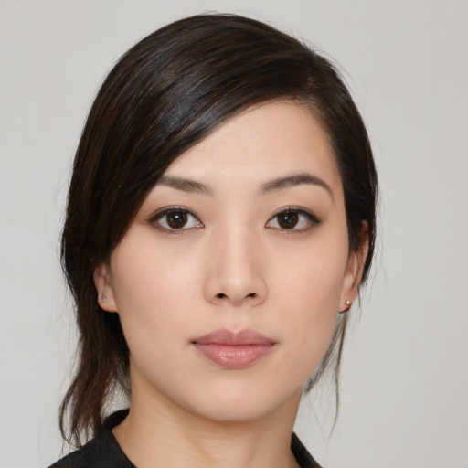 Neutral white young-adult female with medium  black hair and brown eyes