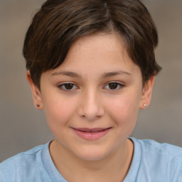 Joyful white child female with short  brown hair and brown eyes