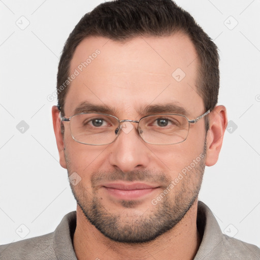 Joyful white adult male with short  brown hair and brown eyes