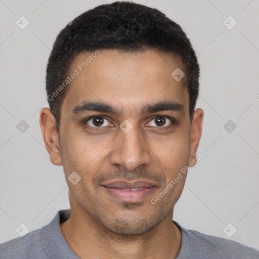 Joyful latino young-adult male with short  brown hair and brown eyes