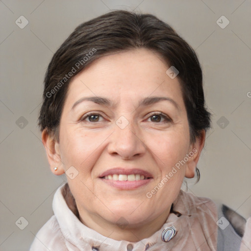 Joyful white adult female with medium  brown hair and brown eyes