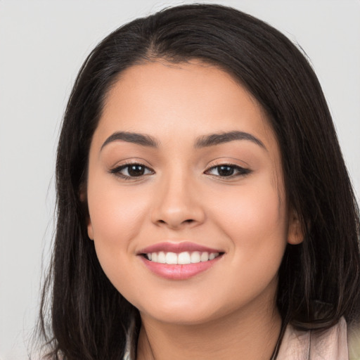 Joyful white young-adult female with long  black hair and brown eyes