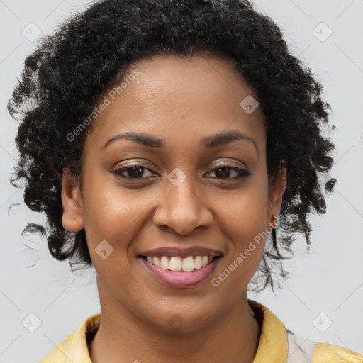 Joyful black young-adult female with short  brown hair and brown eyes