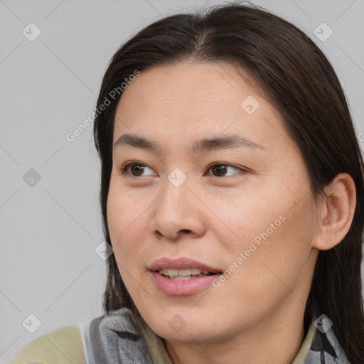 Joyful asian young-adult female with medium  brown hair and brown eyes